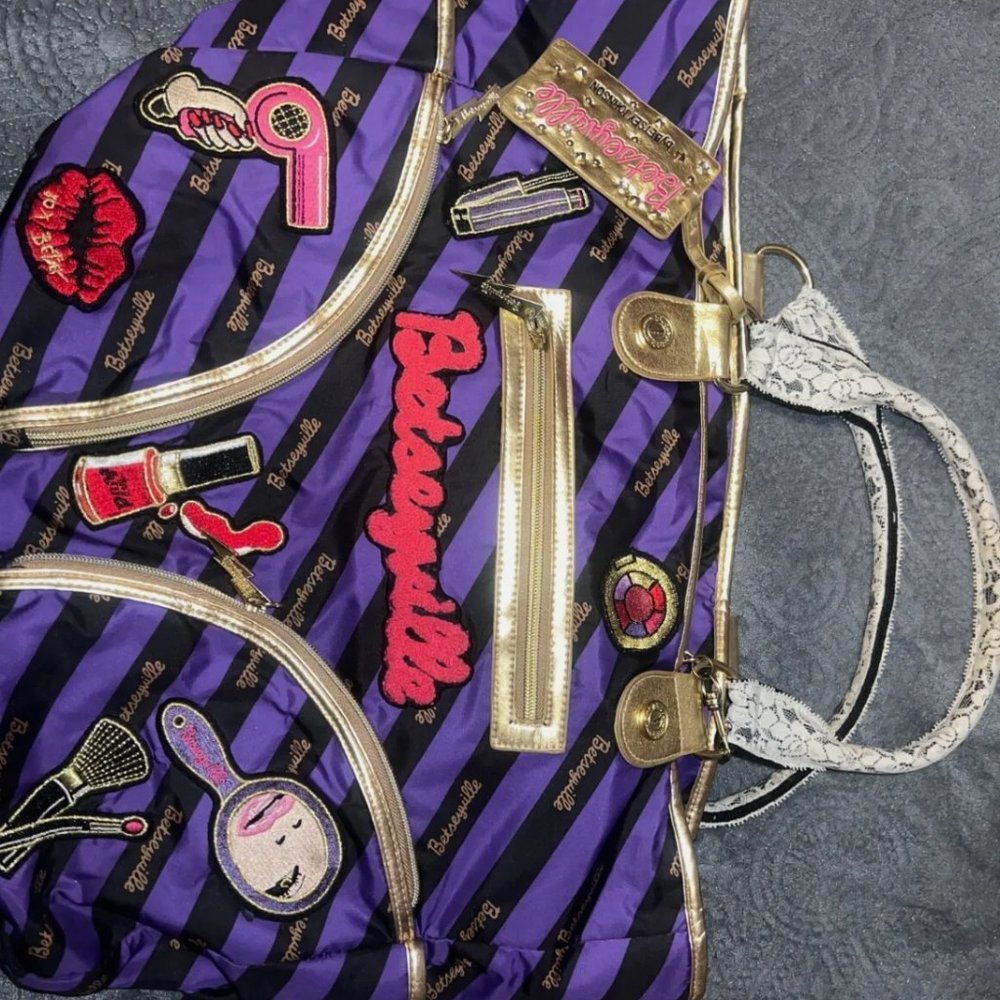 Multi-colored Betsy Johnson tote bag with lace handles and multiple pockets